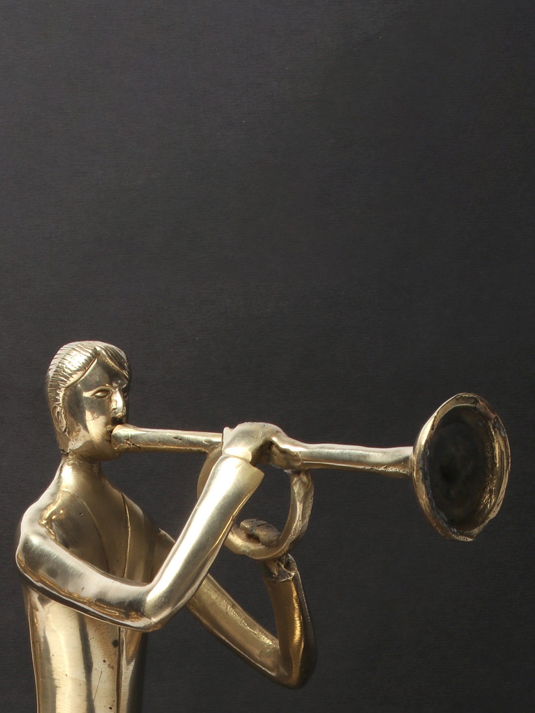 

Exotic India Gold-Toned Brass Trumpet Master Figurine Showpiece