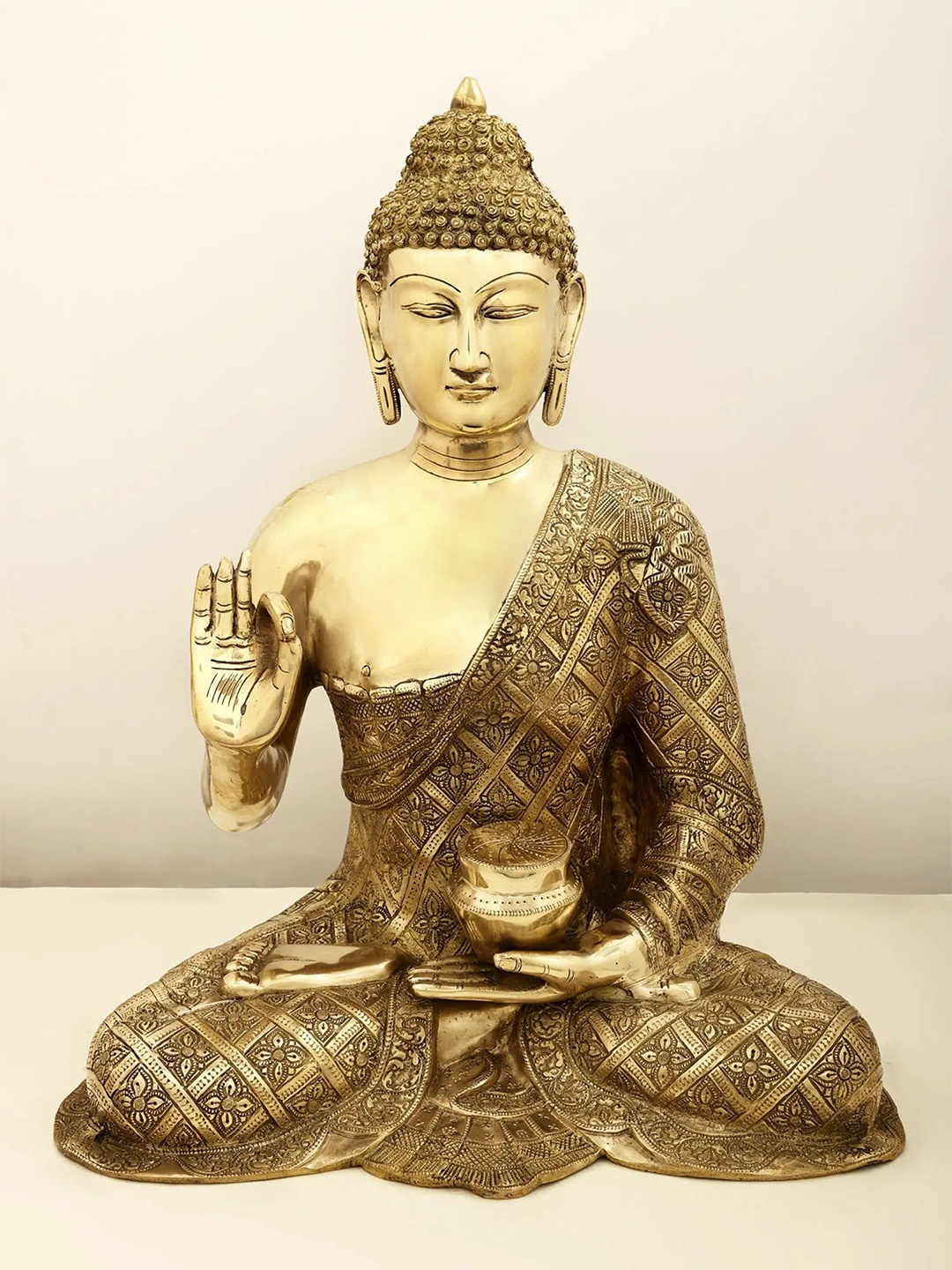 

Exotic India Gold Toned & Cream Buddha Brass Idol Showpiece