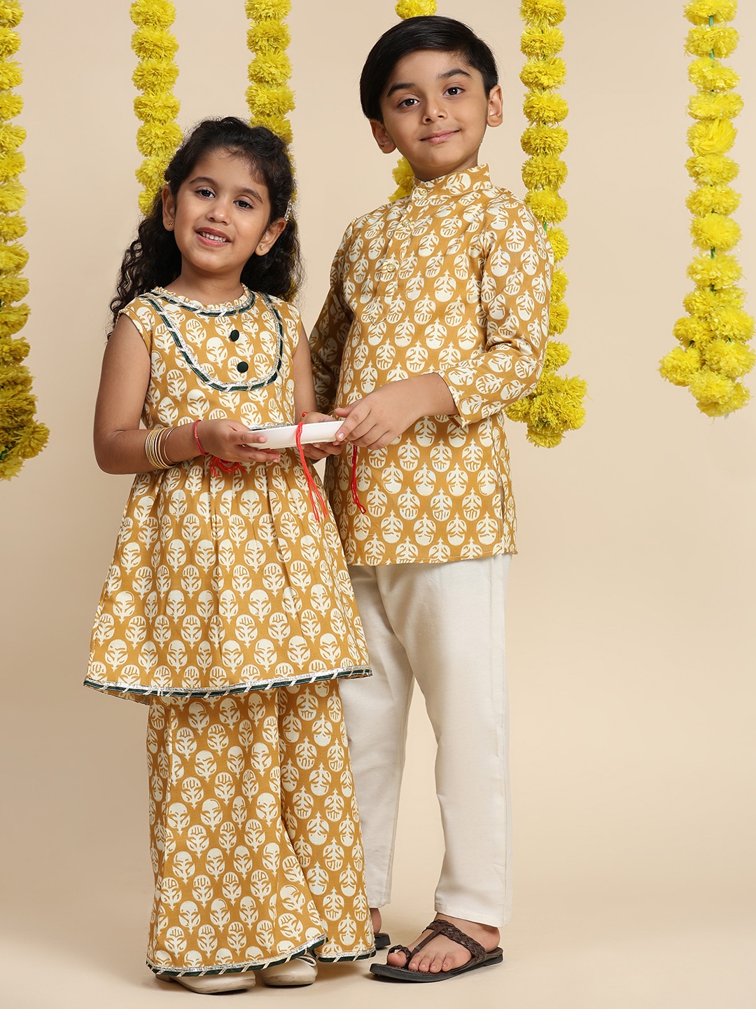 

Cutiekins Girls Floral Printed Sleeveless Gotta Patti A-Line Kurti With Palazzo, Mustard