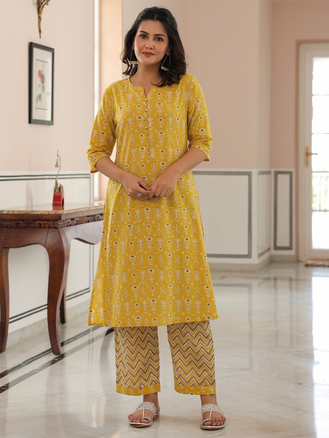 

Aramya Women Ethnic Motifs Printed Regular Beads and Stones Pure Cotton Kurta with Trousers, Yellow