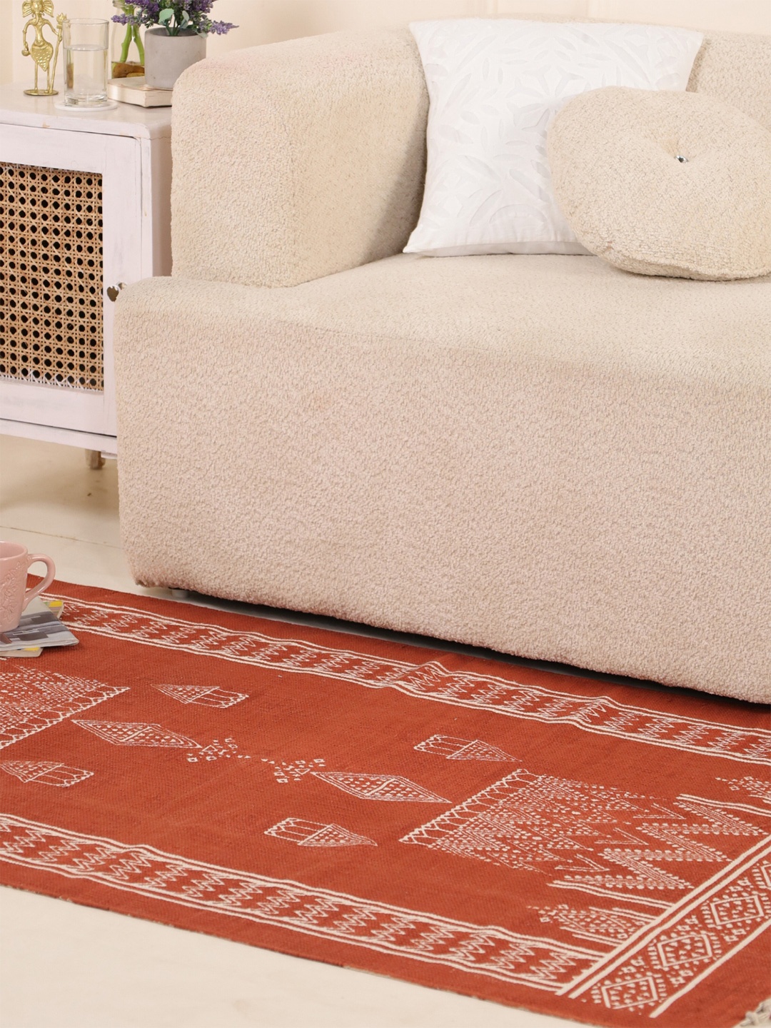 

Peepul Tree Handmade Rust Brown Diamond Motifs Cotton Carpet (3X5ft)