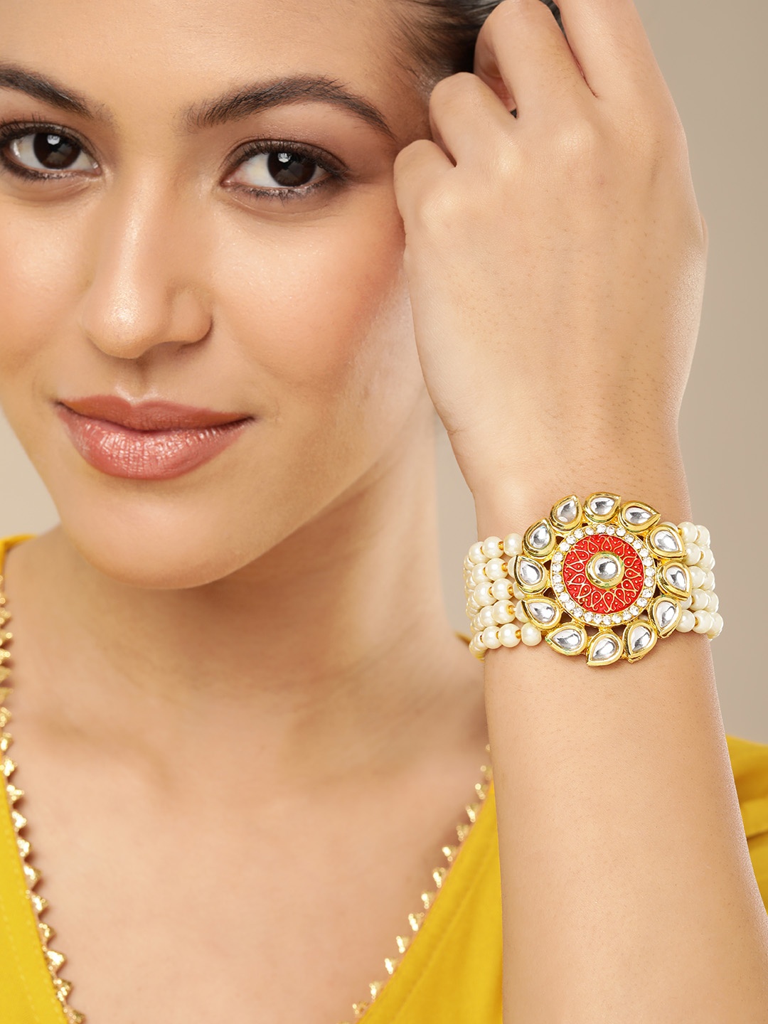 

AARSHVI Women Brass Cubic Zirconia Silver-Plated Armlet Bracelet, Gold