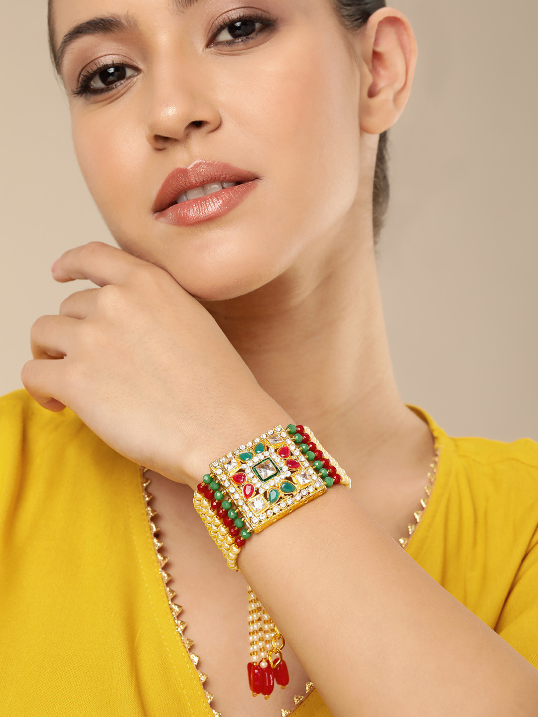 

AARSHVI Women Brass Cubic Zirconia Silver-Plated Armlet Bracelet, Gold