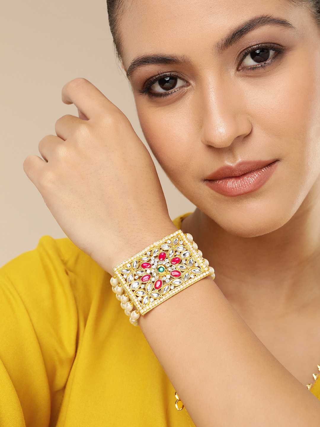 

AARSHVI Women Brass Cubic Zirconia Gold-Plated Armlet Bracelet