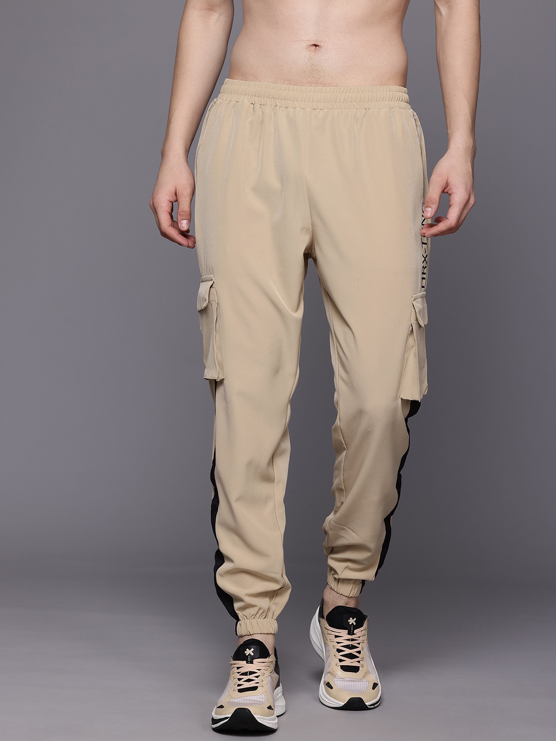 

HRX by Hrithik Roshan Men Brand Logo Print Detail Mid-Rise Rapid-Dry Training Joggers, Beige