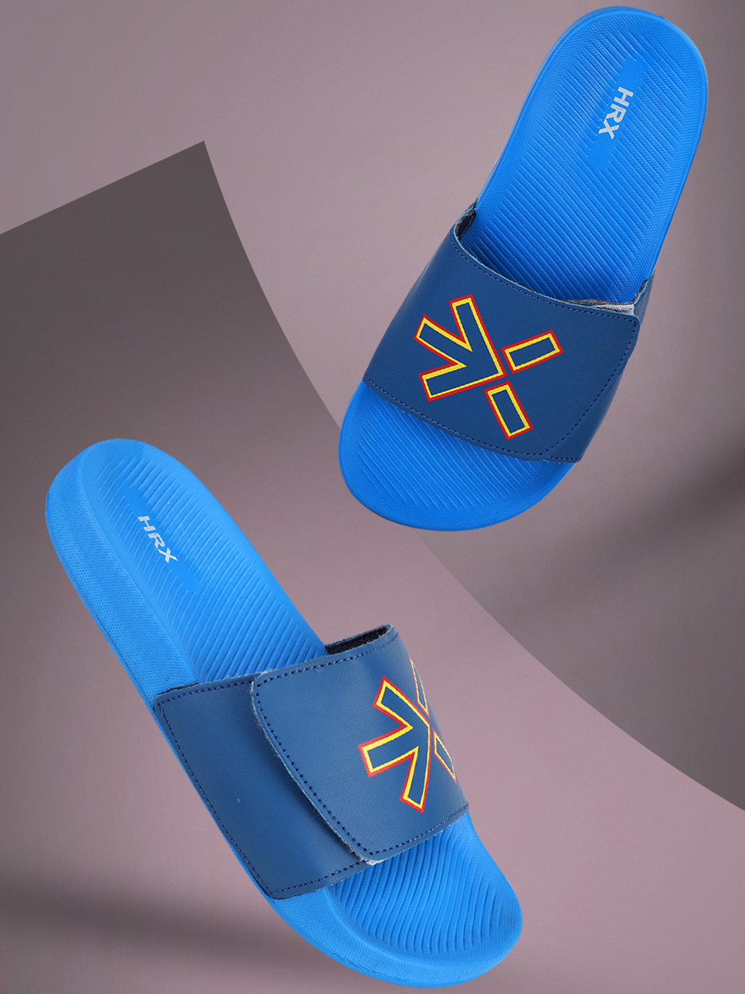 

HRX by Hrithik Roshan Solid Men Sliders, Blue