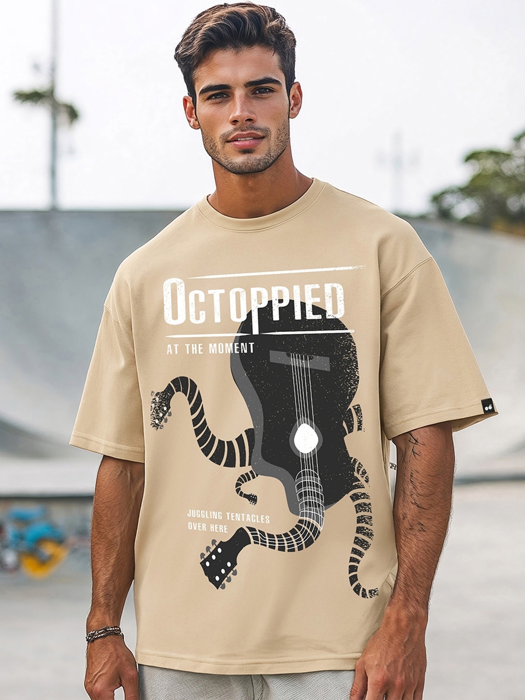 

Bewakoof Men Graphic Printed Round Neck Cotton Oversized T-Shirt, Brown