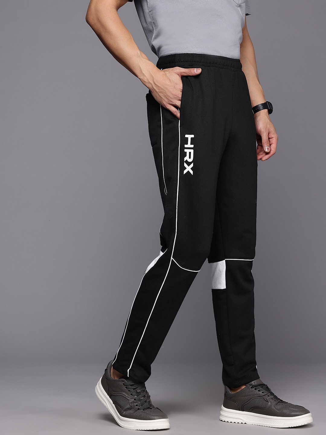 

HRX by Hrithik Roshan Men Monochrome Printed Detail Lifestyle Track Pants, Black