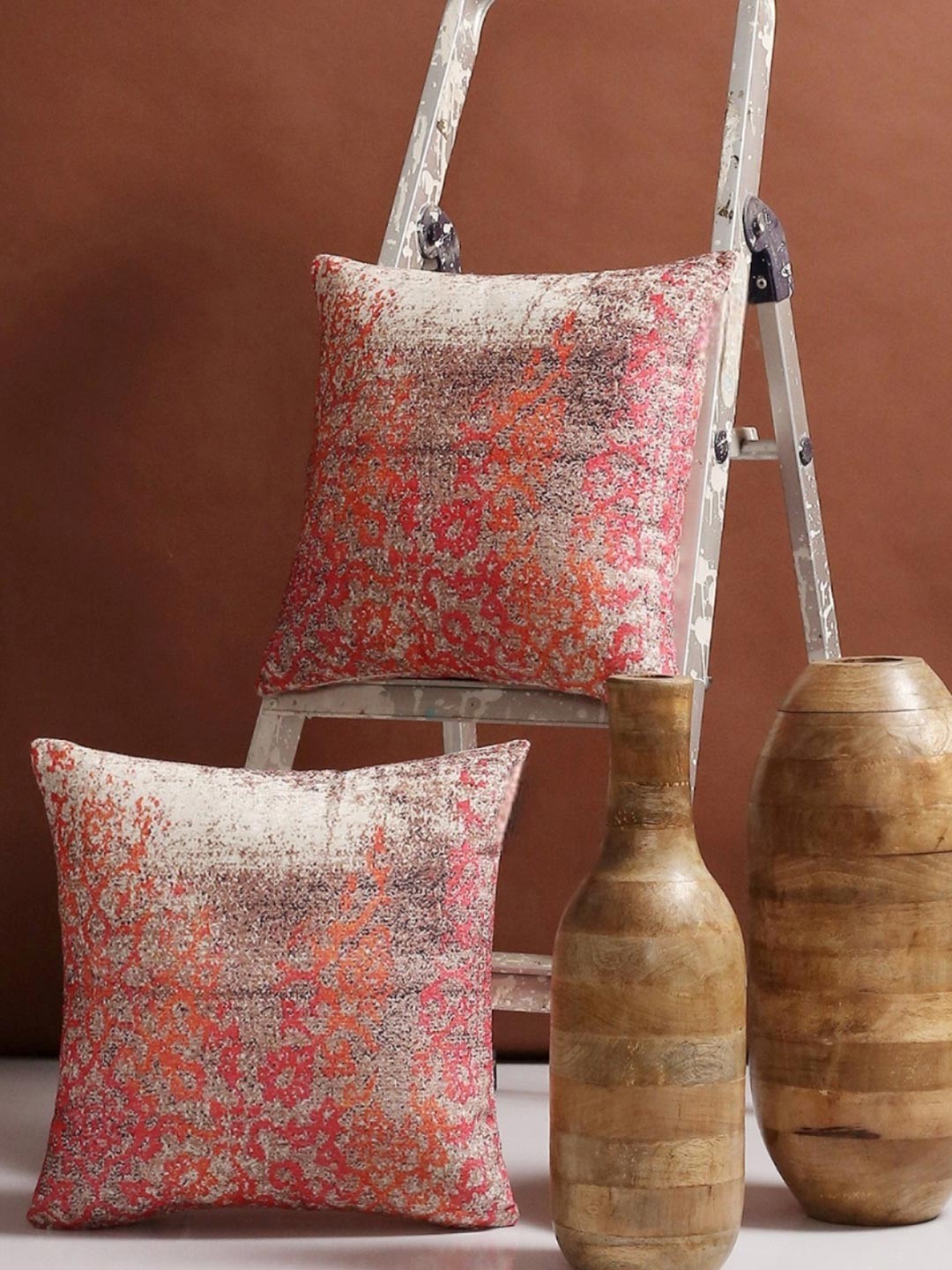 

Myntra Elegant Homes Pink & Orange Colored 2 Pieces Ethnic Motifs Square Cushion Covers