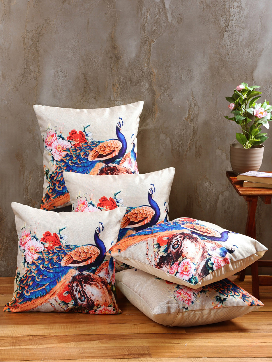 

Myntra Elegant Homes Cream Colored & Blue 5 Pieces Peacock Printed Square Cushion Covers