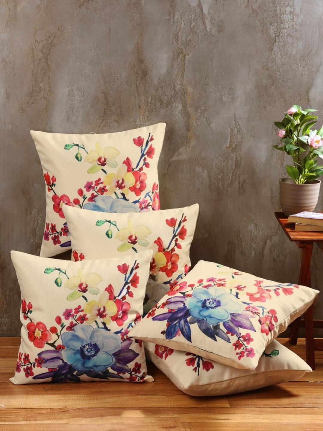 

Myntra Elegant Homes Cream Coloured & Blue 5 Pieces Floral Square Cushion Covers