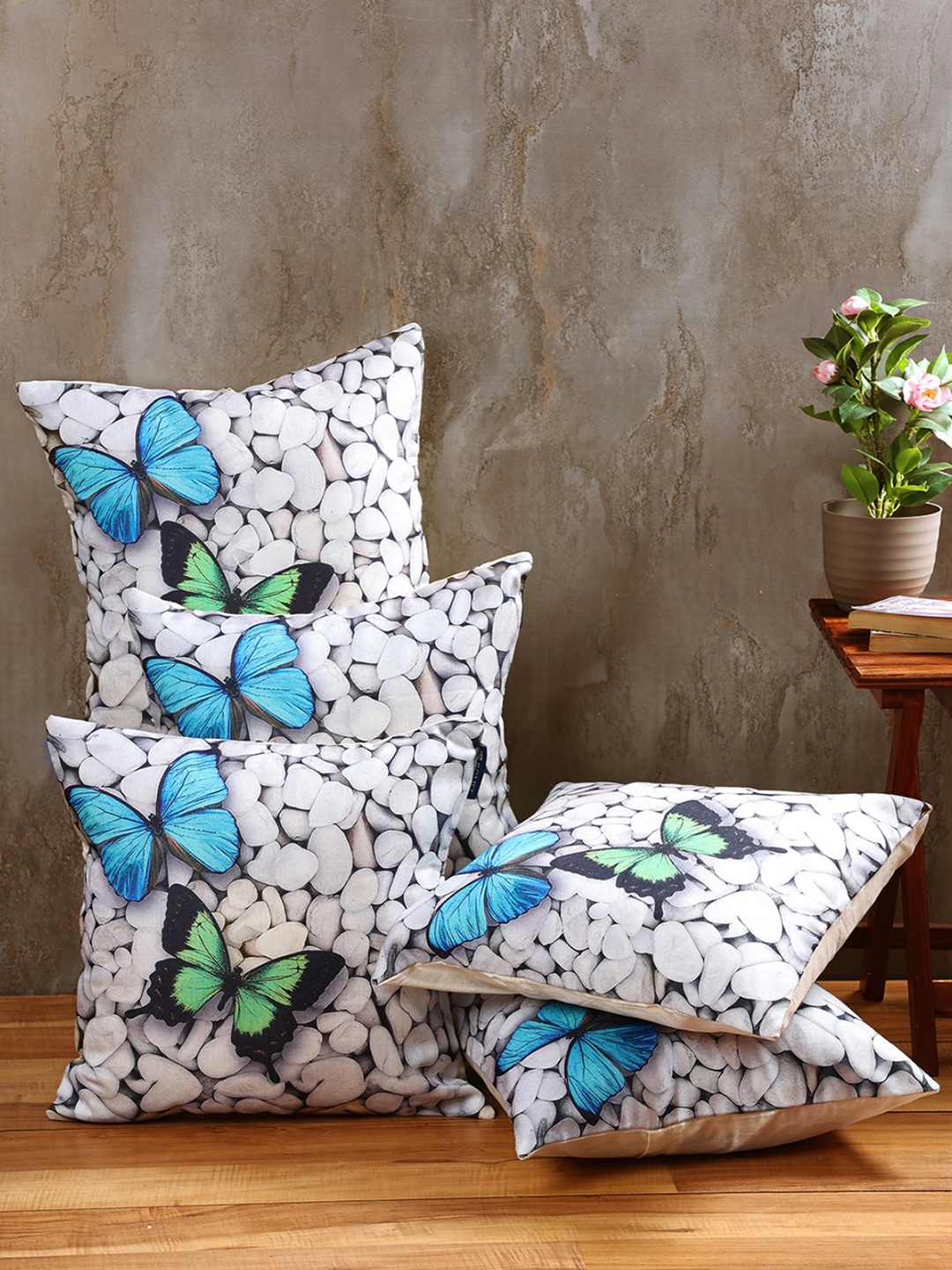 

Myntra Elegant Homes White & Black 5 Pieces Butterfly Printed Square Cushion Covers