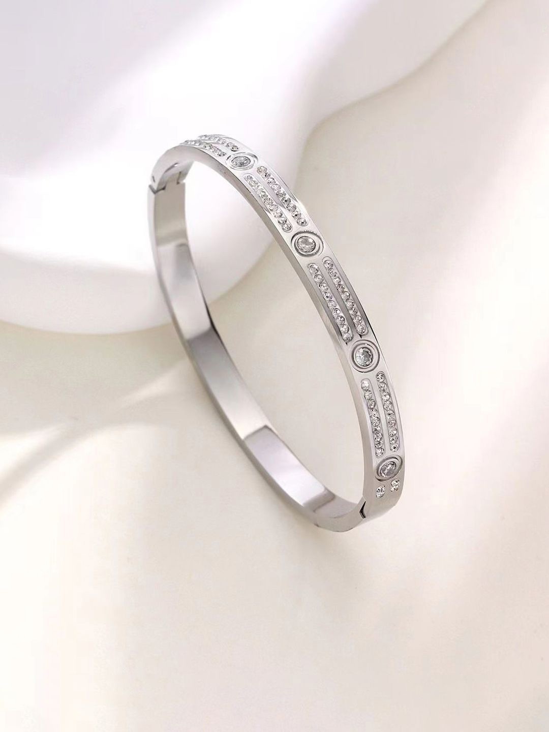

Jewels Galaxy Silver-Plated Stainless Steel American Diamond Bangle-Style Bracelet