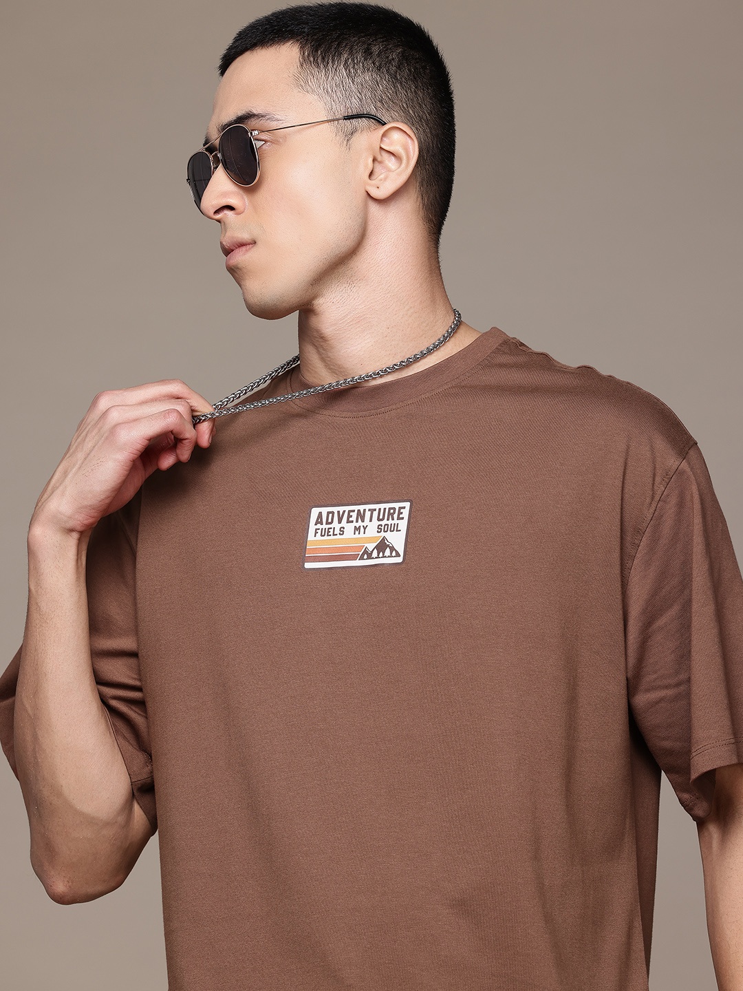 

The Roadster Lifestyle Co. Graphic Print Detail Drop-Shoulder Sleeves Cotton T-shirt, Brown