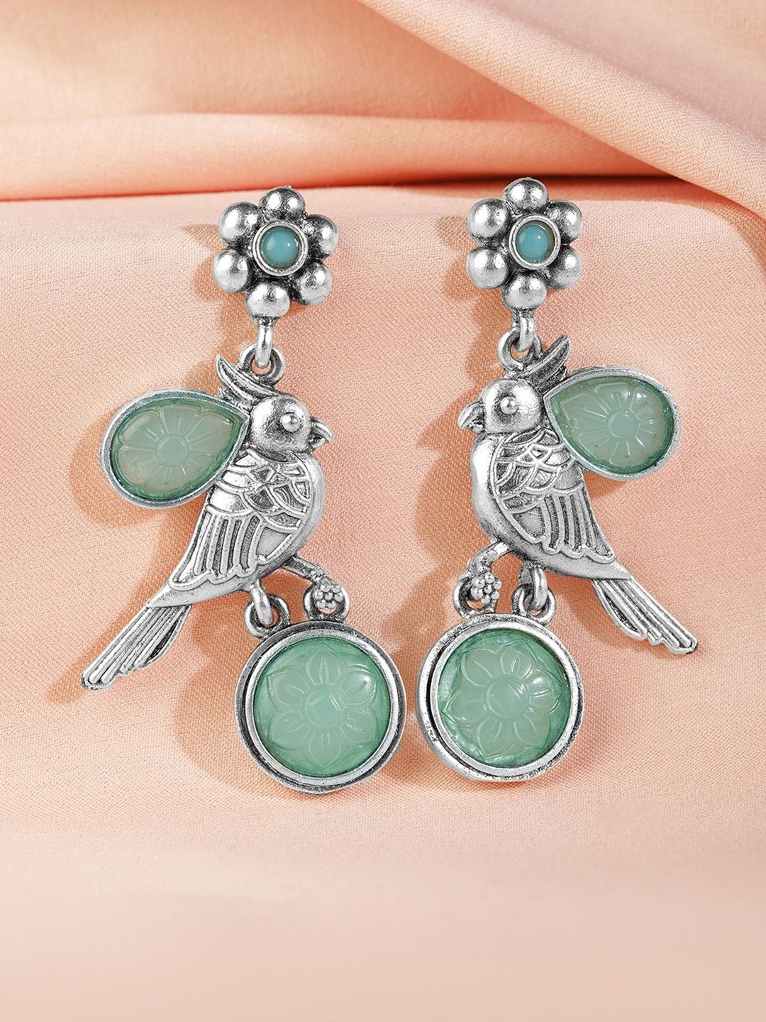 

Rubans Oxidised Silver Parrot Motif Drop Earrings with Mint Green Carved Stone Detailing