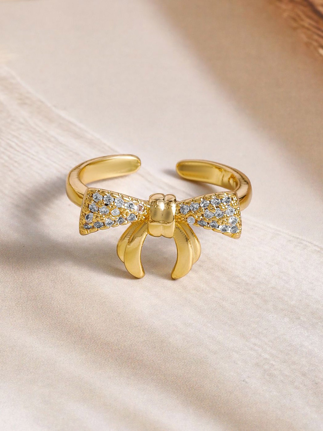 

Rubans 18K Gold Plated Bow Charm Adjustable Finger Ring with Cubic Zirconia Studded
