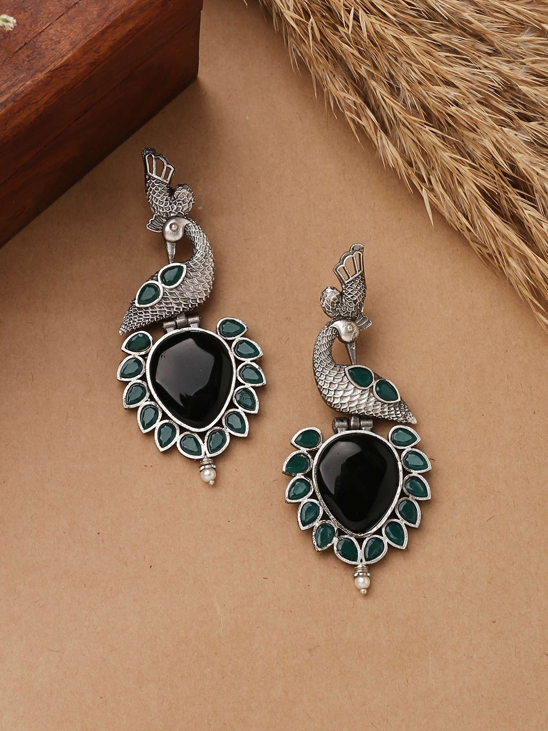 

Mirraw Silver-Plated Stones Studded Peacock Shaped Drop Earrings