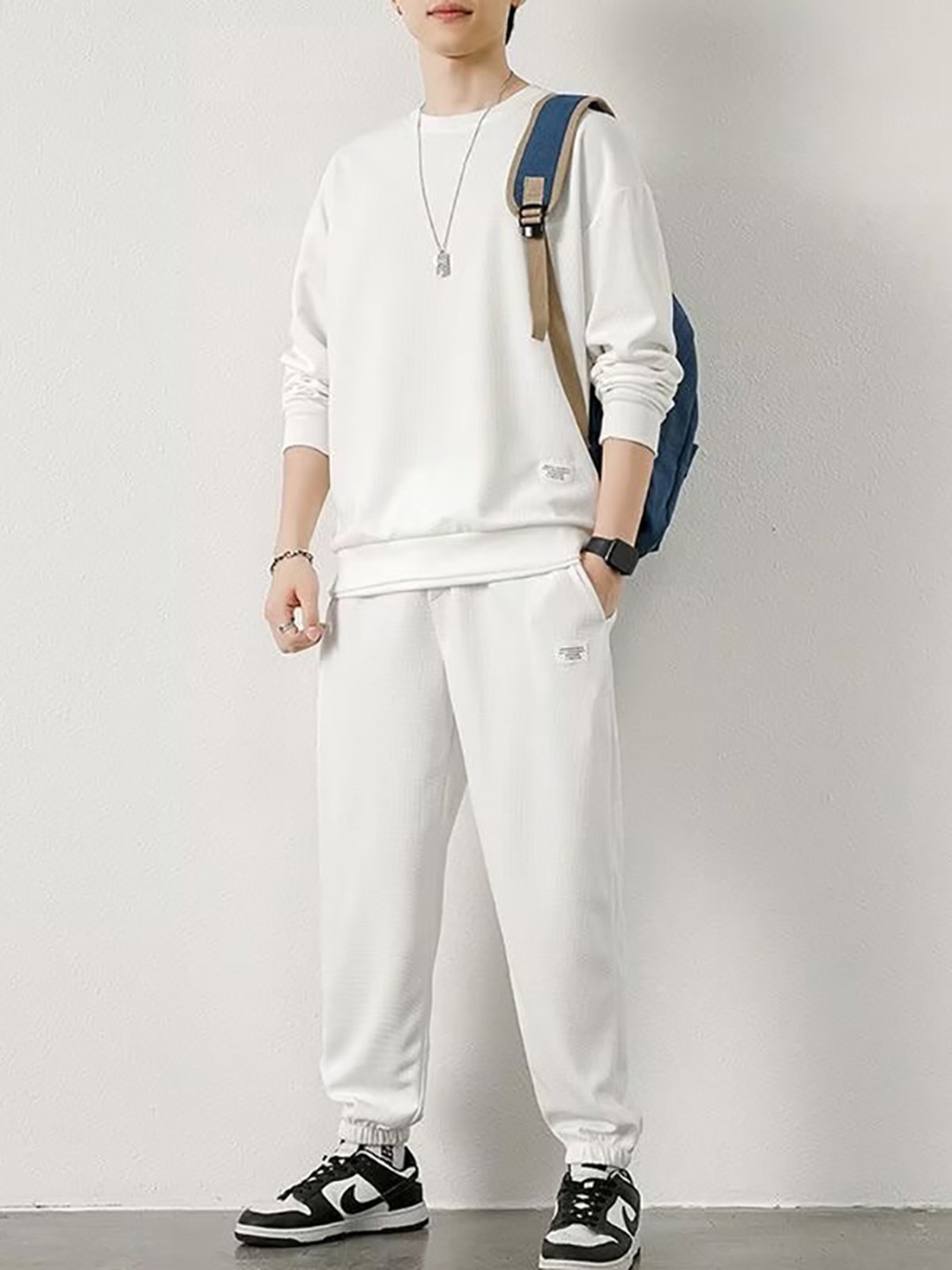 

StyleCast x Revolte White V-Neck Tracksuits