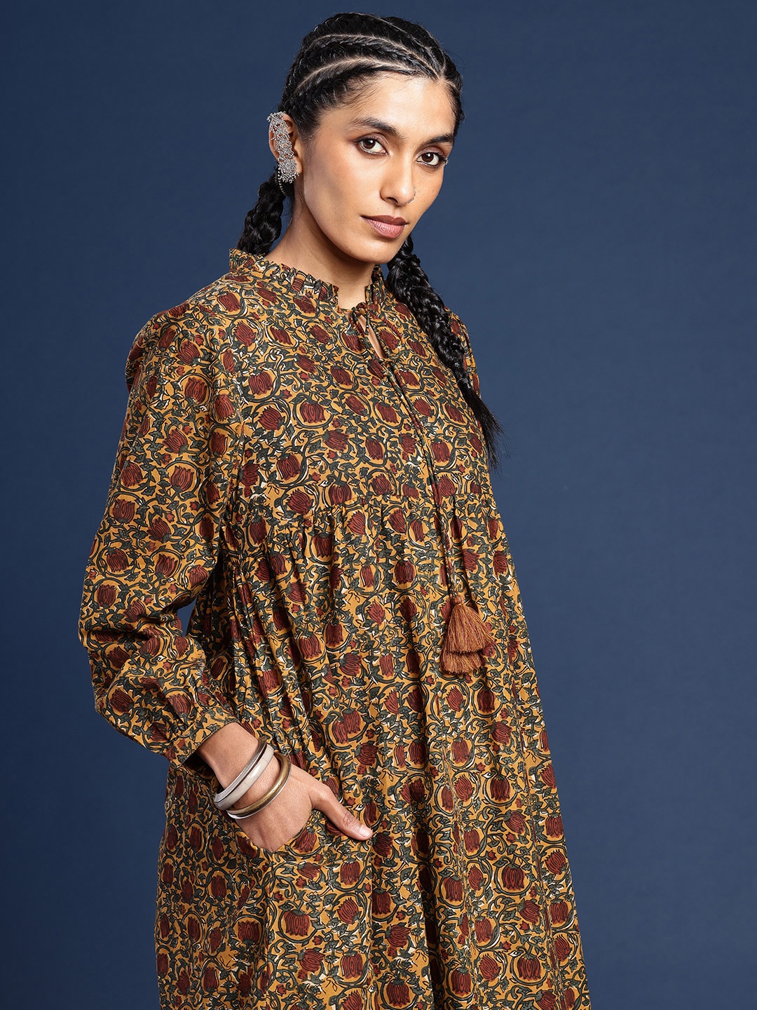 

Taavi Bagru Indie Florals Printed Tie-Up Neck Pure Cotton A-Line Kurta, Yellow