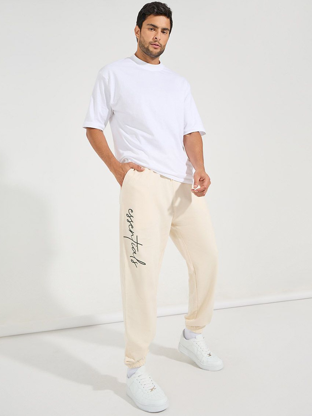 

Styli Men Slogan Print Oversized Fit Jogger with Slip Pocket, Cream