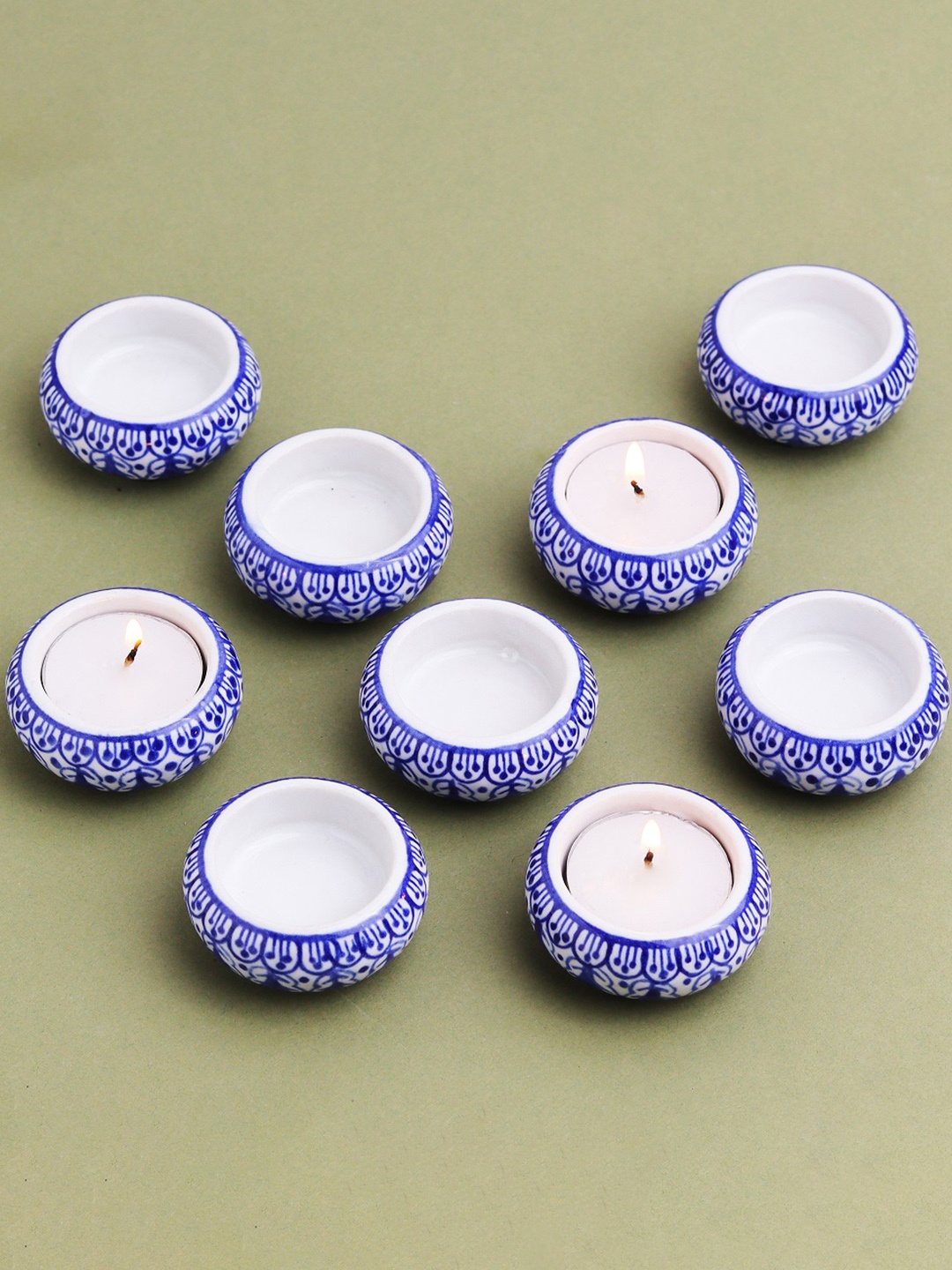 

Indianshelf Cream Coloured & Black 9 Pieces Printed Ceramics Candle Holders