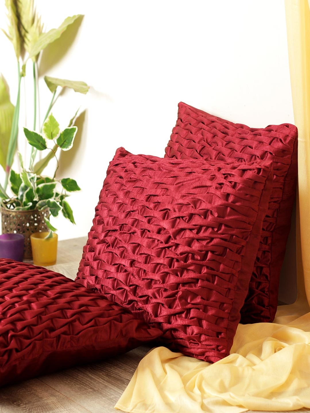 

Myntra Elegant Homes Maroon 3 Pieces Geometric Textured Square Cushion Covers