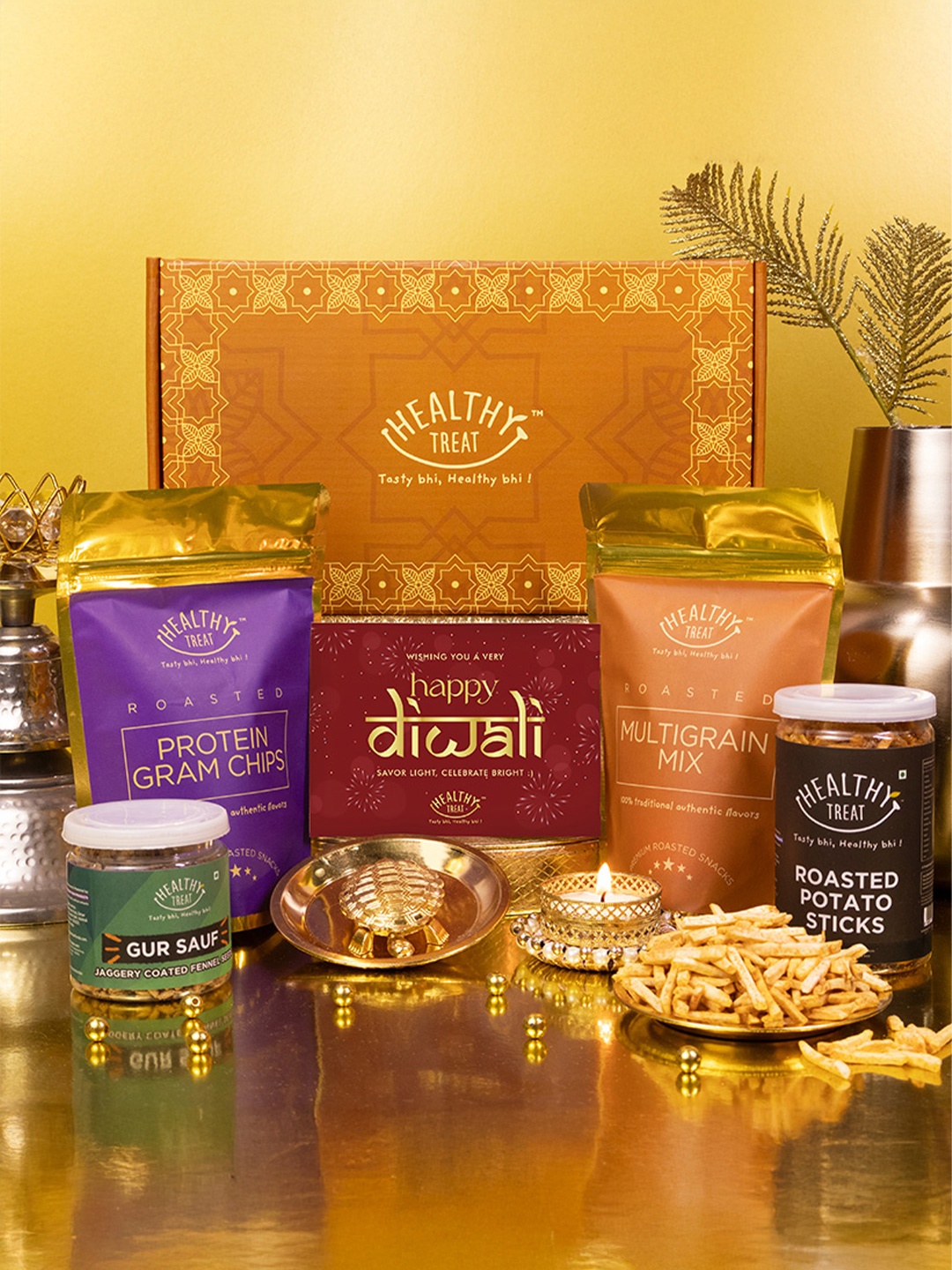 

Healthy Treat Set Of 7 Roasted Snack With Turtle Diya & Diwali Card, Orange