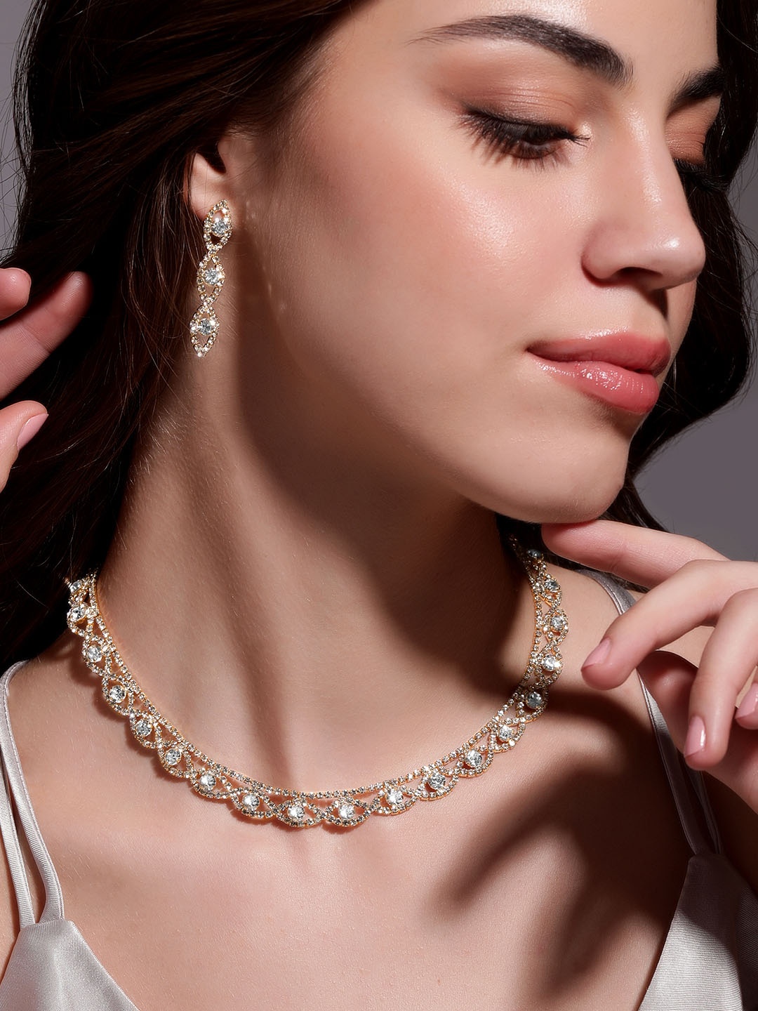

Rubans 18K Gold Plated AD & White Cubic Zirconia Studded Necklace and Earring Set
