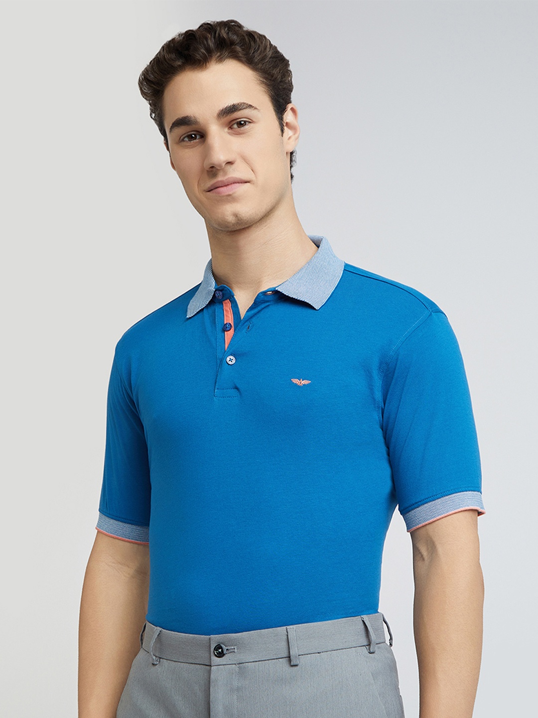 

Park Avenue Men Solid Polo Collar Cotton T-shirt, Blue