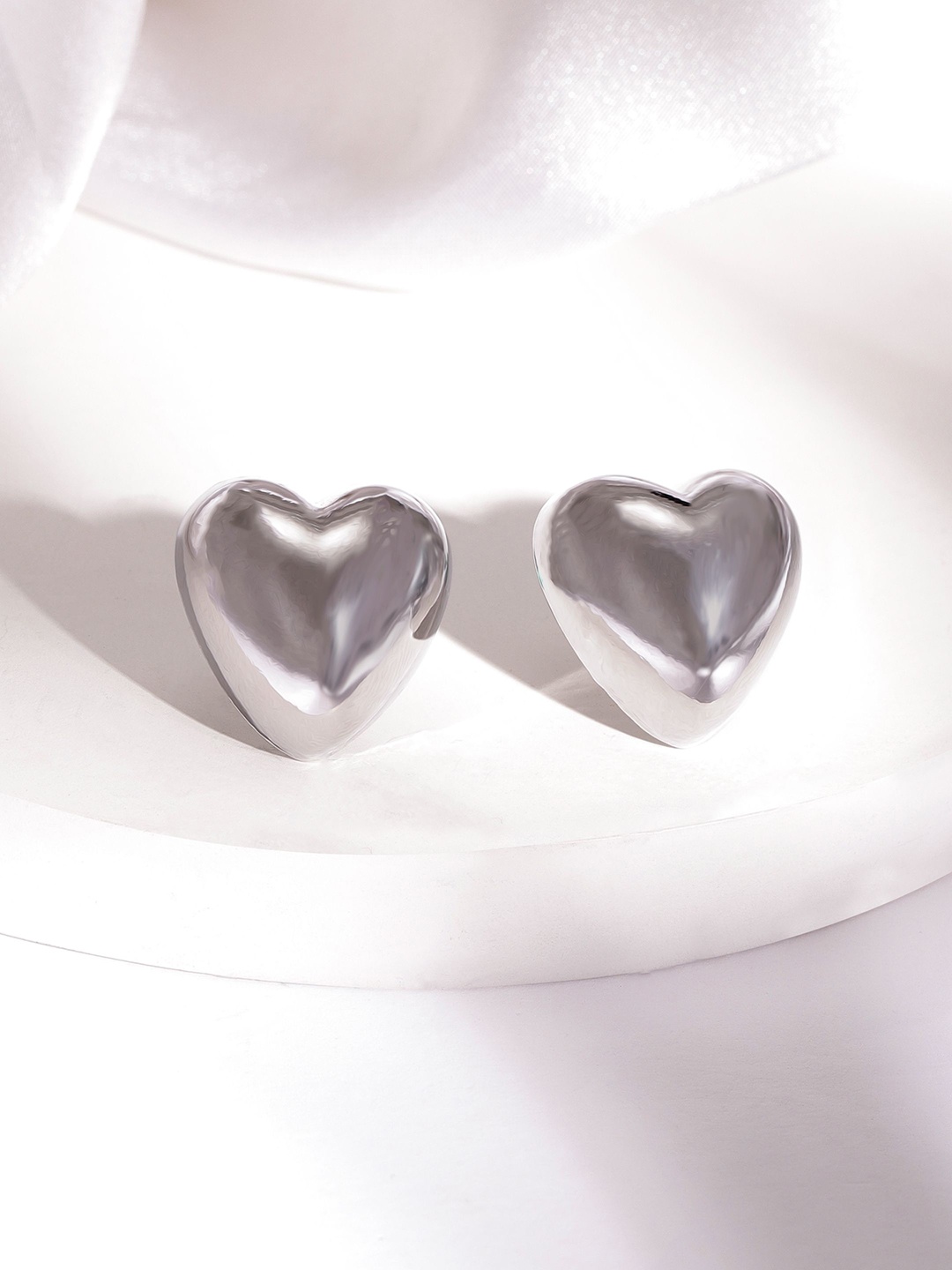 

Rubans Rhodium Plated Heart Shaped Stud Earrings with Sleek Silver Tone Finish