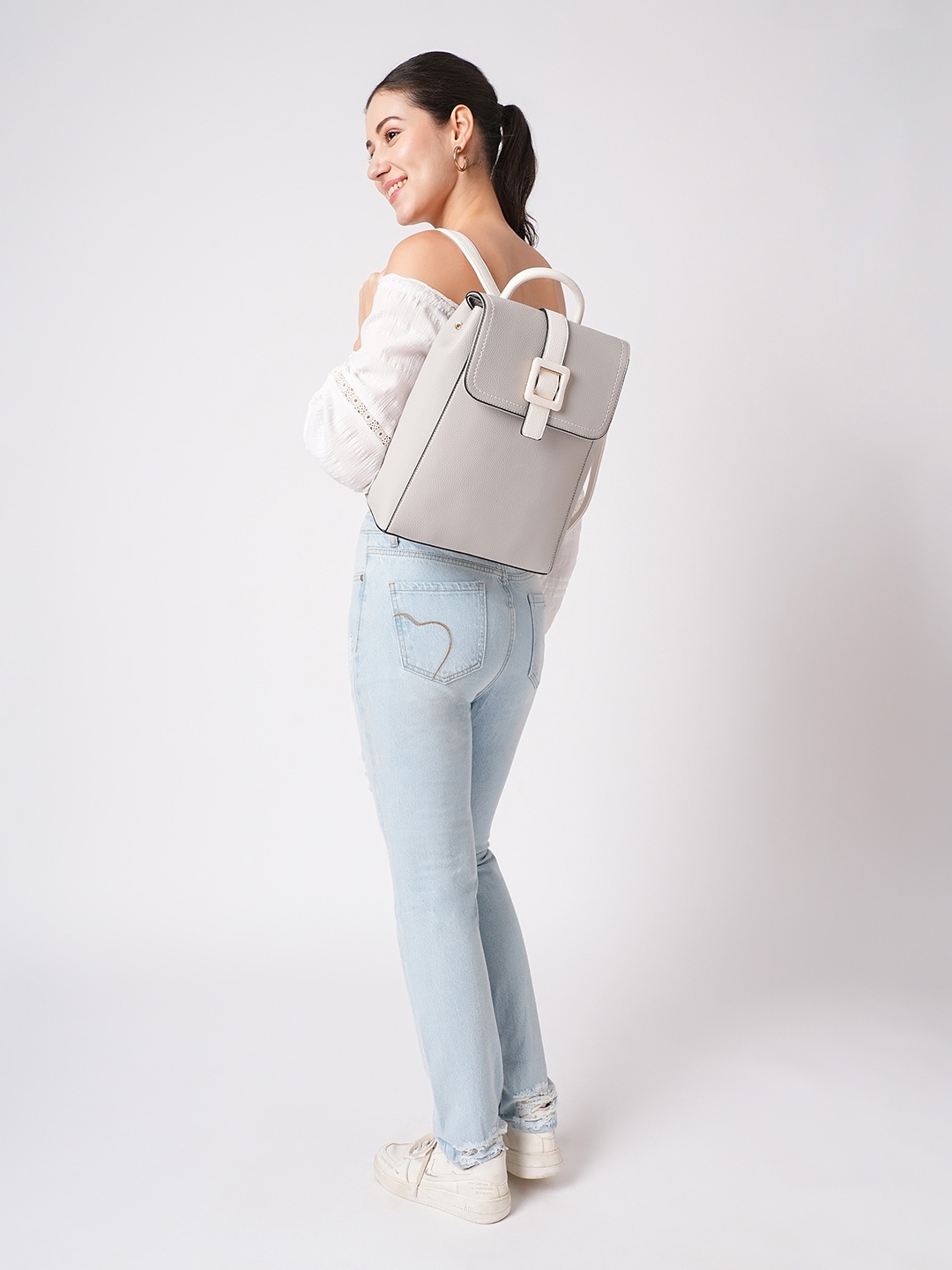 

Globus Women Solid Buckle Detail Yoke Style Strap Medium Backpack, Grey