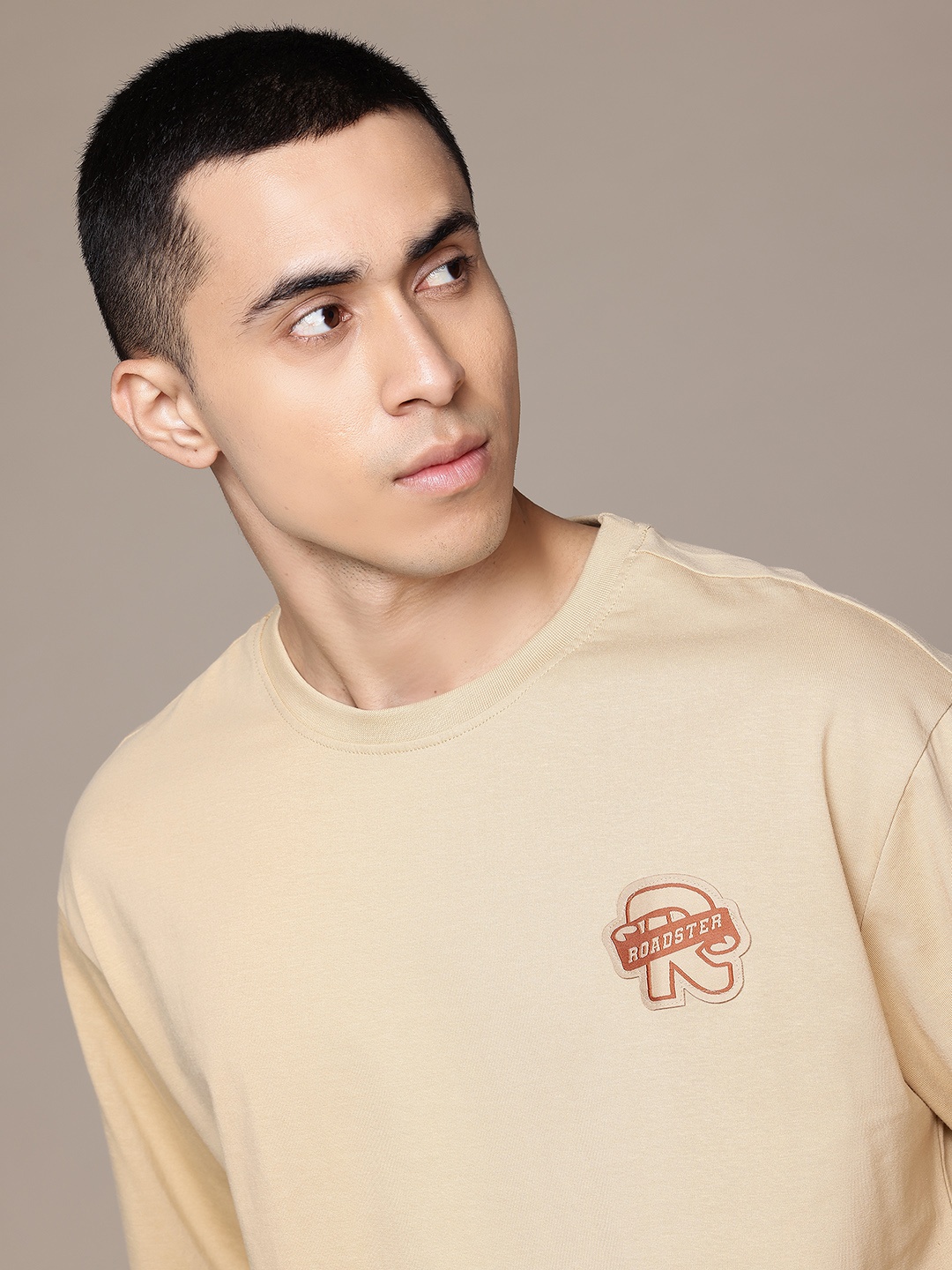 

The Roadster Lifestyle Co. Drop-Shoulder Sleeves Pure Cotton Applique T-shirt, Beige