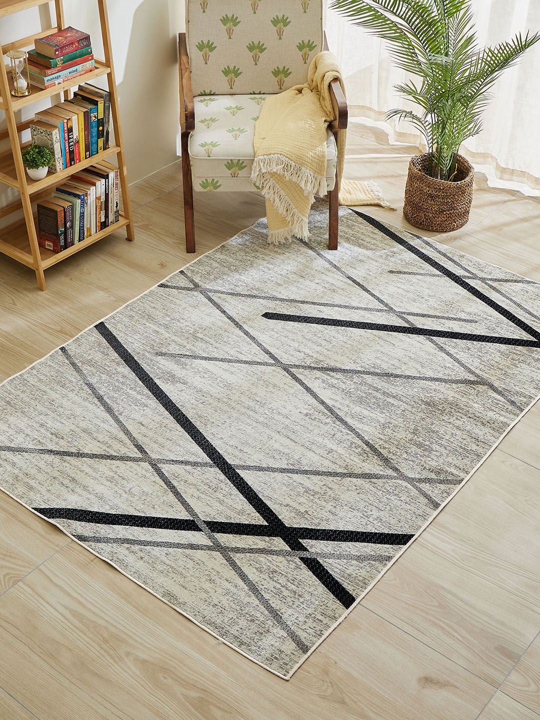 

Home Centre Vienna Paloma Beige & Black Abstract Printed Woven Carpet