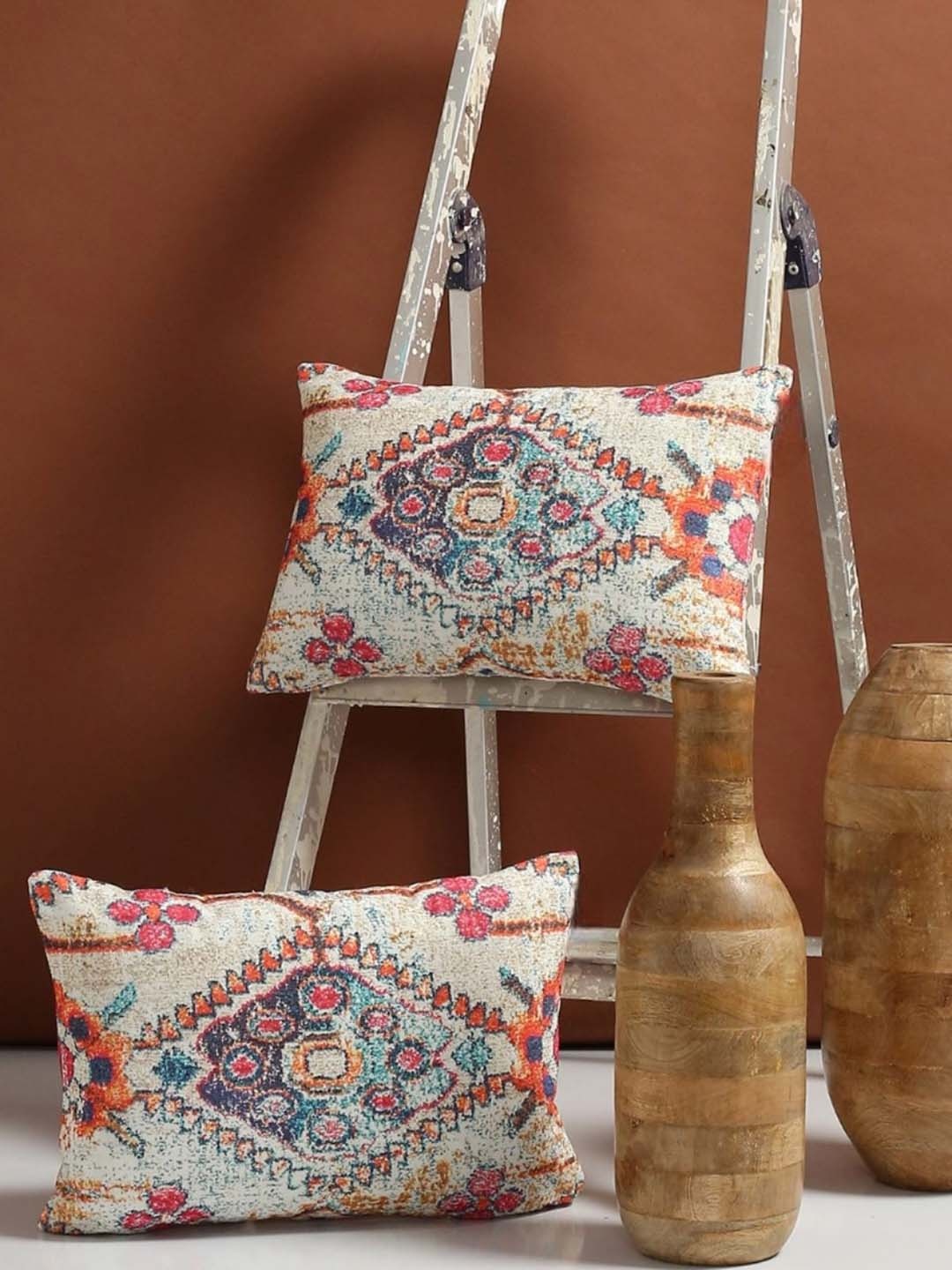 

Myntra Elegant Homes Cream-Coloured & Blue 2 Pieces Ethnic Motifs Rectangle Cushion Covers