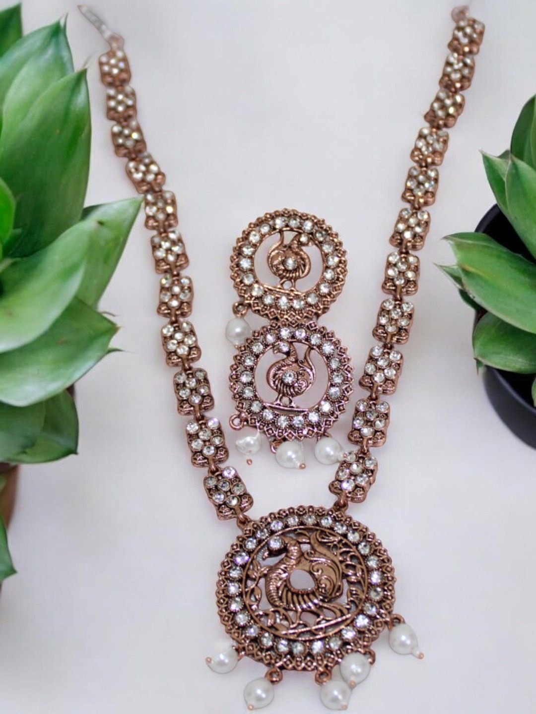 

Jolly Faces Copper Plated Stone Studded Necklace and Earrings