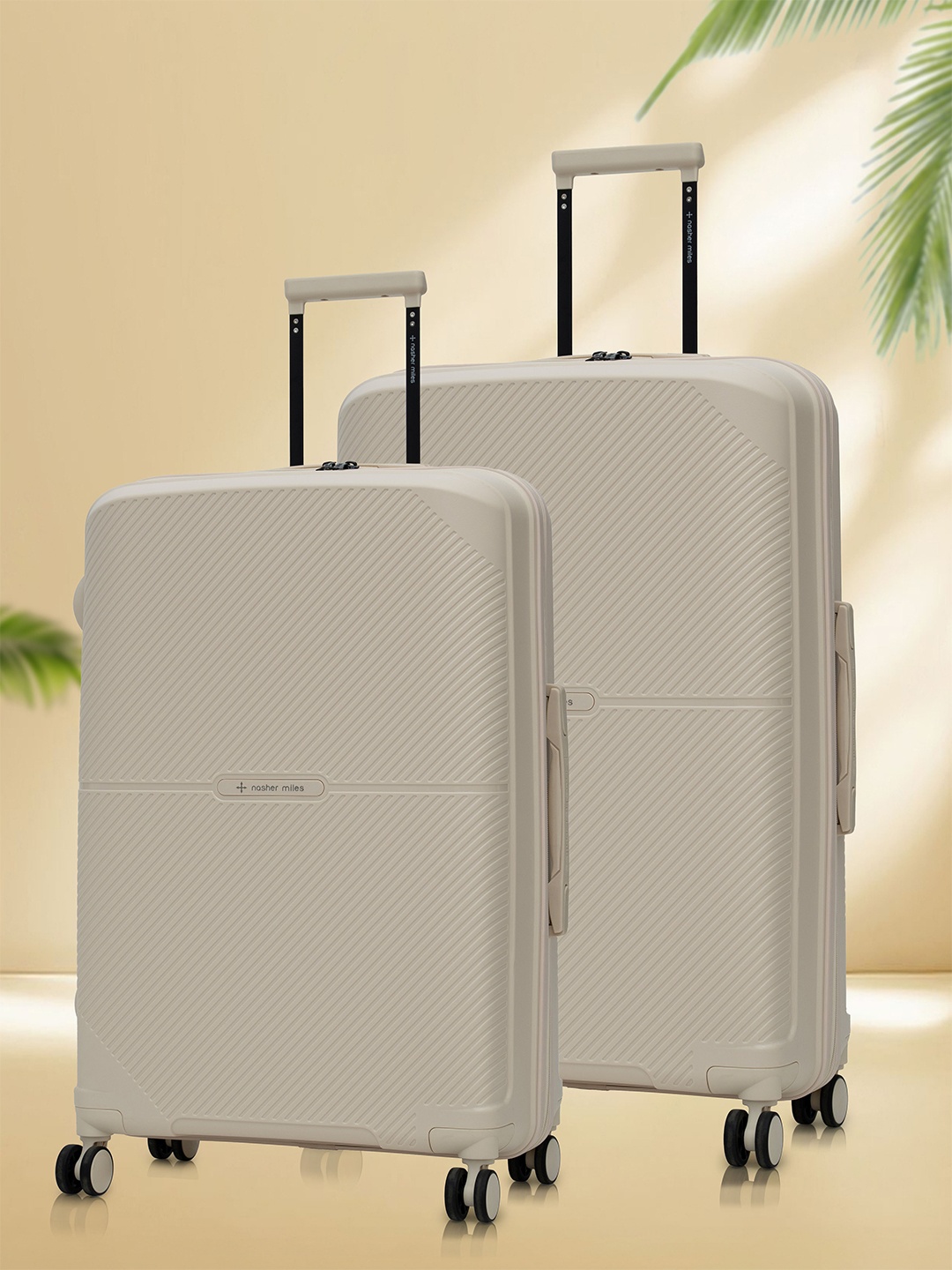 

Nasher Miles Hawaii Polypropylene TSA Lock Set of 2 M/L White Trolley Bags (65-75 cm)