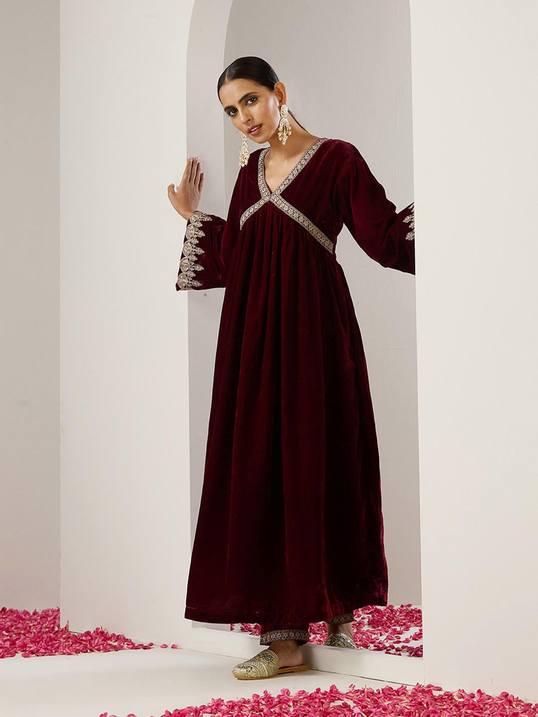 

Ishin Purple Ethnic Motifs Embroidered Flared Sleeves Velvet A-Line Kurta With Trousers, Maroon