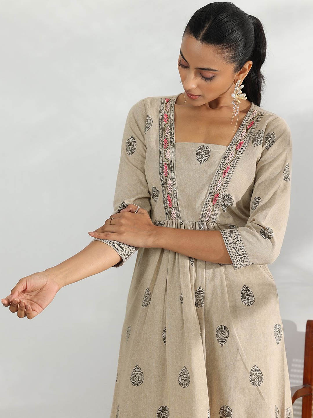 

Libas Beige and Black Ethnic Motifs Printed Pleated Sequinned A-Line Kurta with Trousers