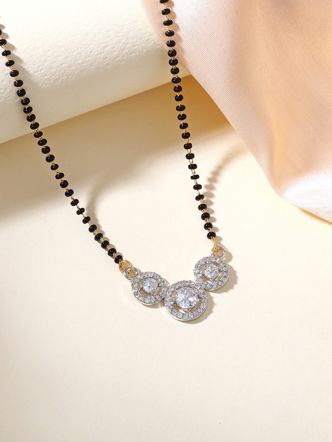 

Estele Gold-Plated Crystals Srudded Mangalsutra