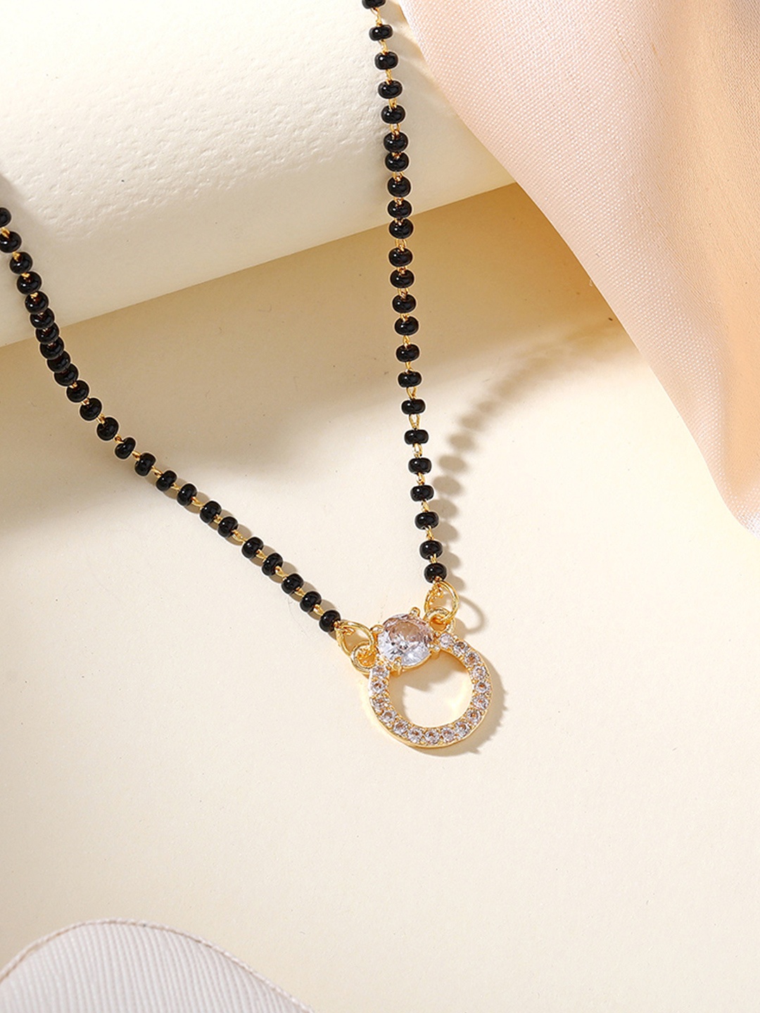 

Estele Gold-Plated Crystals Stone Studded Mangalsutra