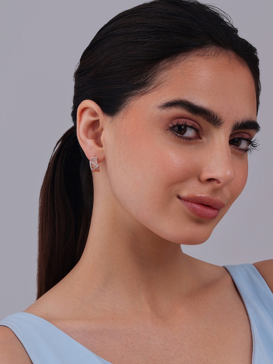 

Kushal's Fashion Jewellery Rose Gold Plated Zircon Studded Triangular Hoop Earrings