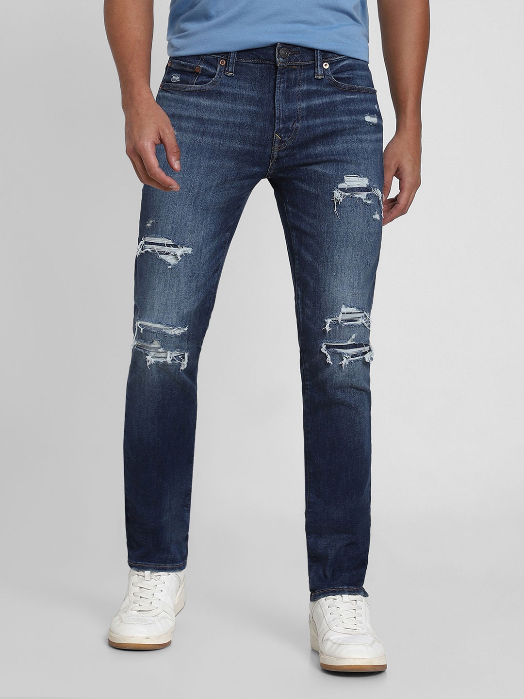 

AMERICAN EAGLE OUTFITTERS Men Slim Fit Mildly Distressed Light Fade Jeans, Blue