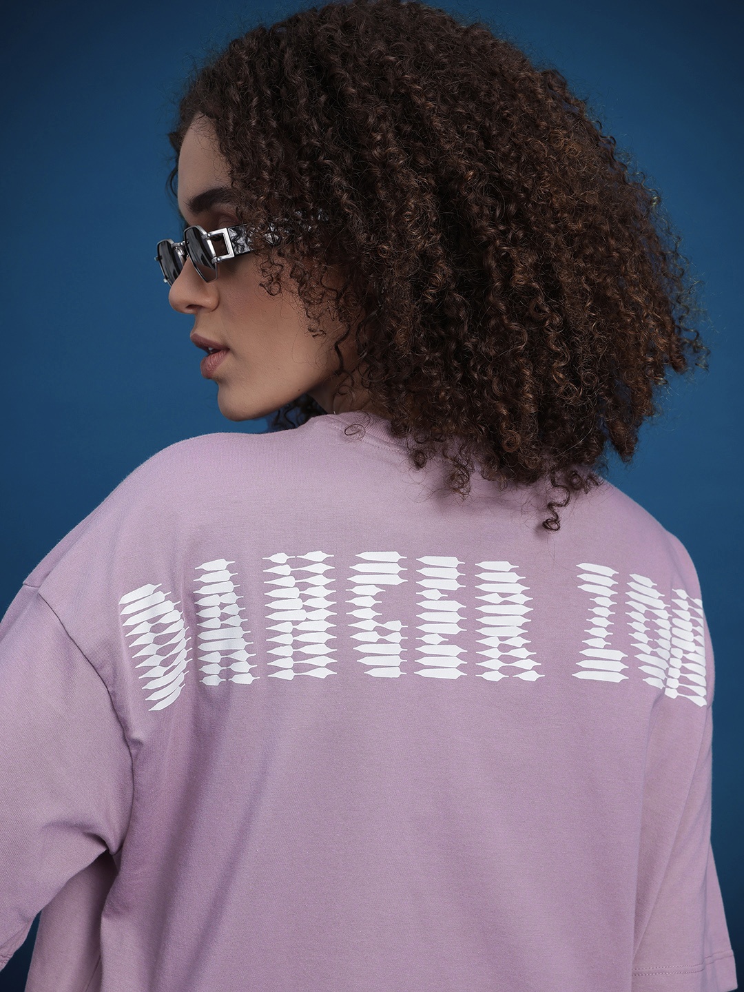 

The Roadster Life Co. Graphic Printed Drop-Shoulder Sleeves Oversized T-shirt, Lavender
