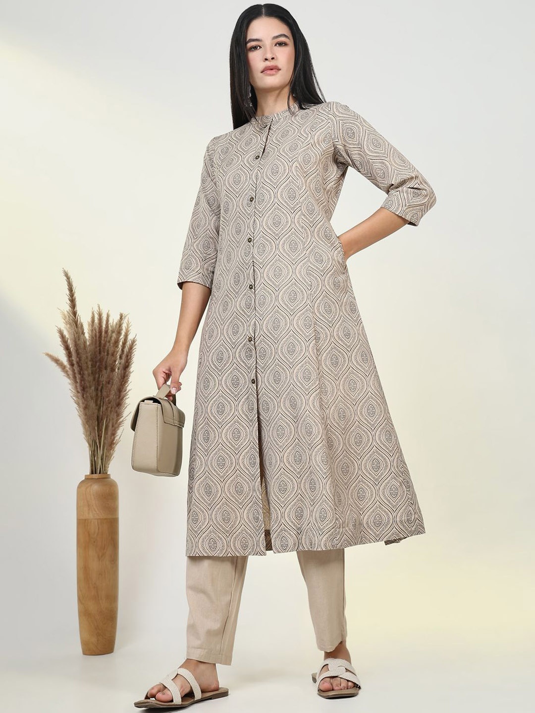 

Angvarnika Geometric Printed Mandarin Collar A-Line Kurta With Palazzos, Beige