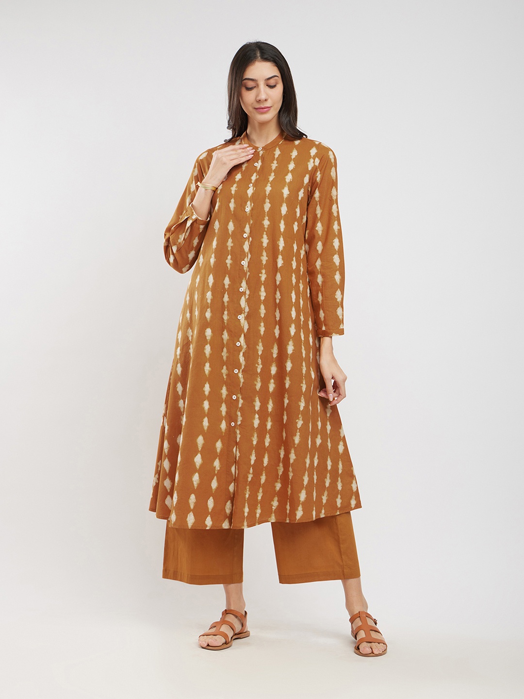 

Pink Fort Women Printed Regular Pure Cotton Kurta with Trousers, Mustard