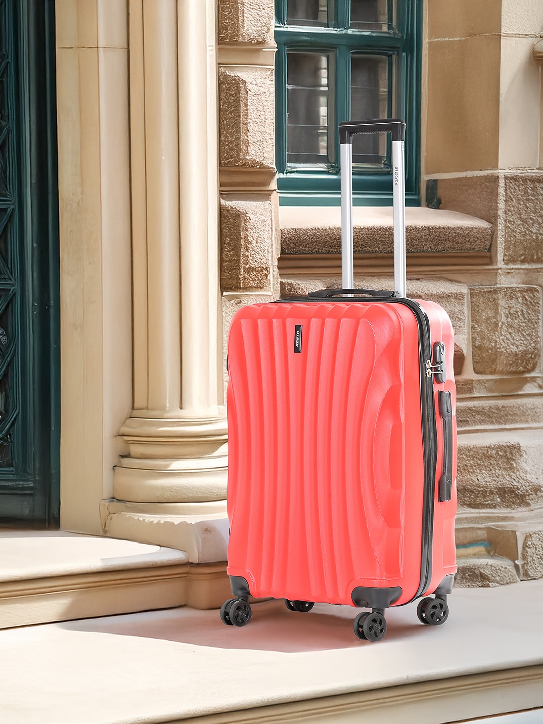 

Roadster Unisex Textured Hard Sided Medium Trolley Suitcase- 55.7 L, Red