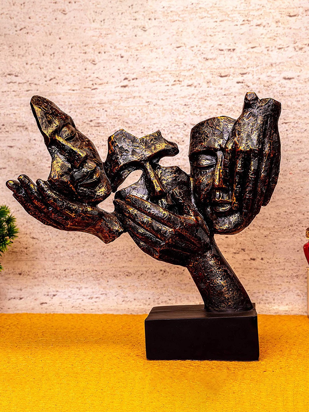 

NAYRA HANDICRAFTS Black & Gold Toned Faces Figurine Showpiece