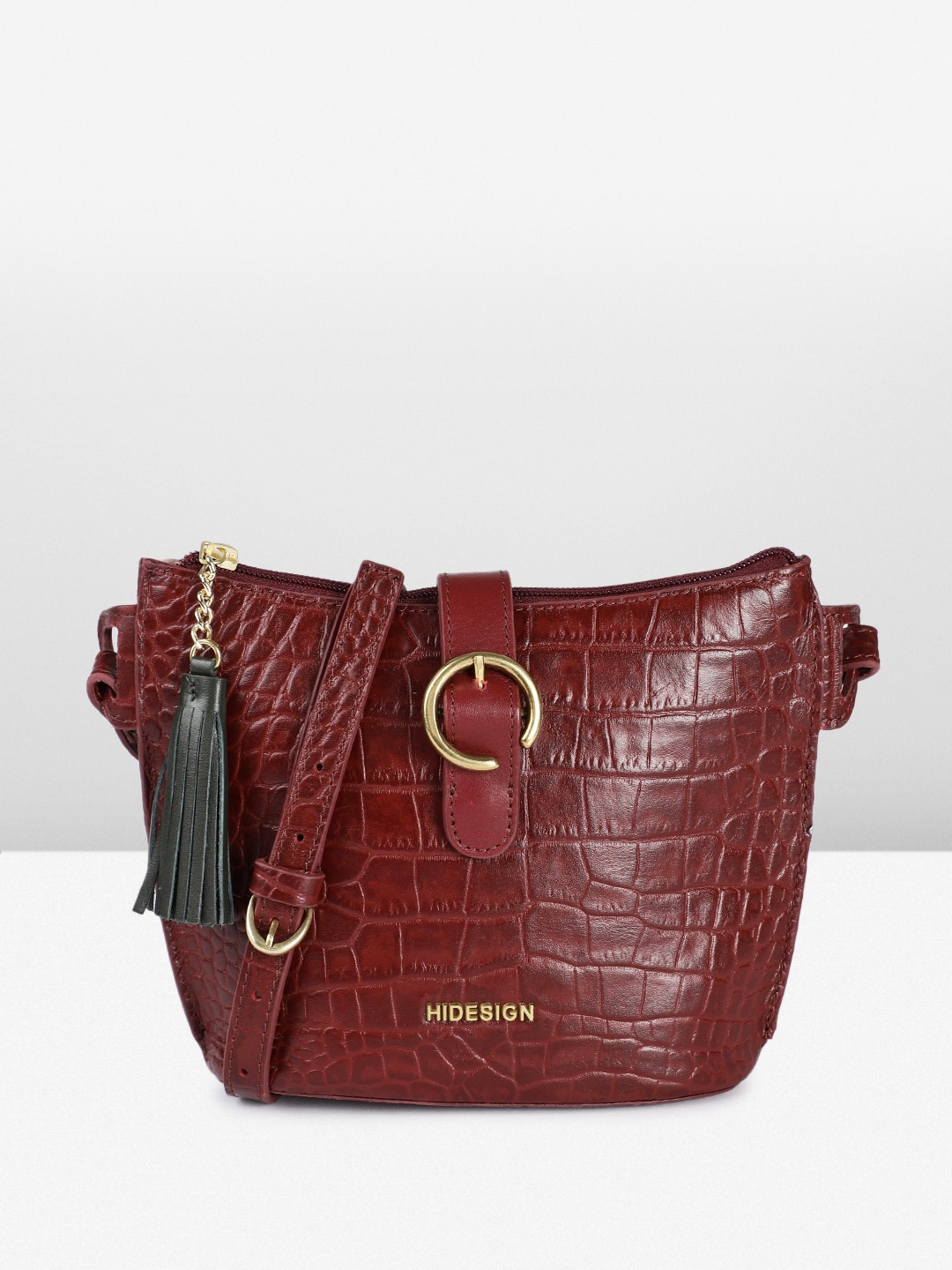 

Hidesign Animal Textured Leather Structured Sling Bag with Tasselled Detail, Maroon