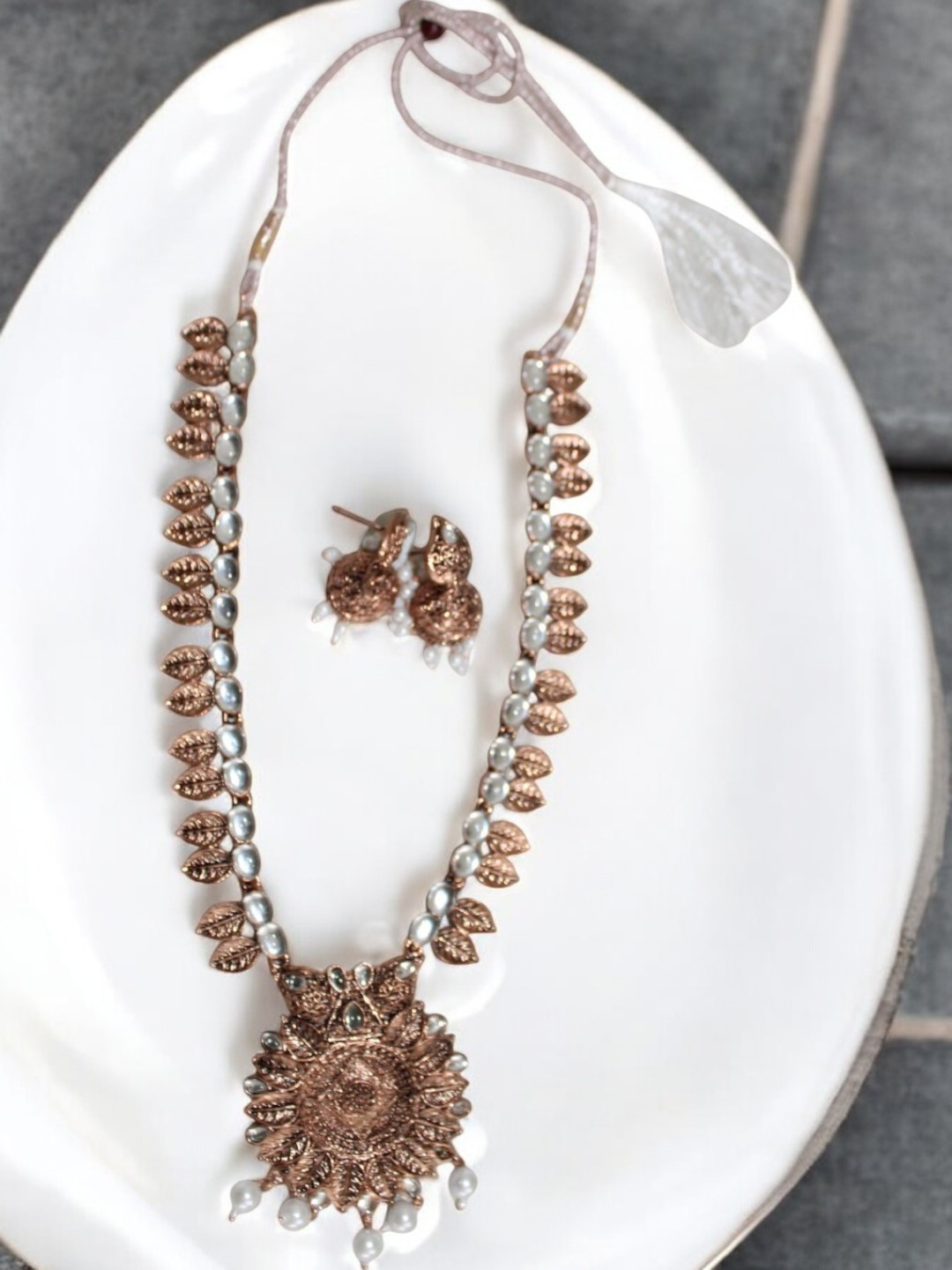 

Jolly Faces Copper Plated Stone Studded & Beaded Jewellery Set