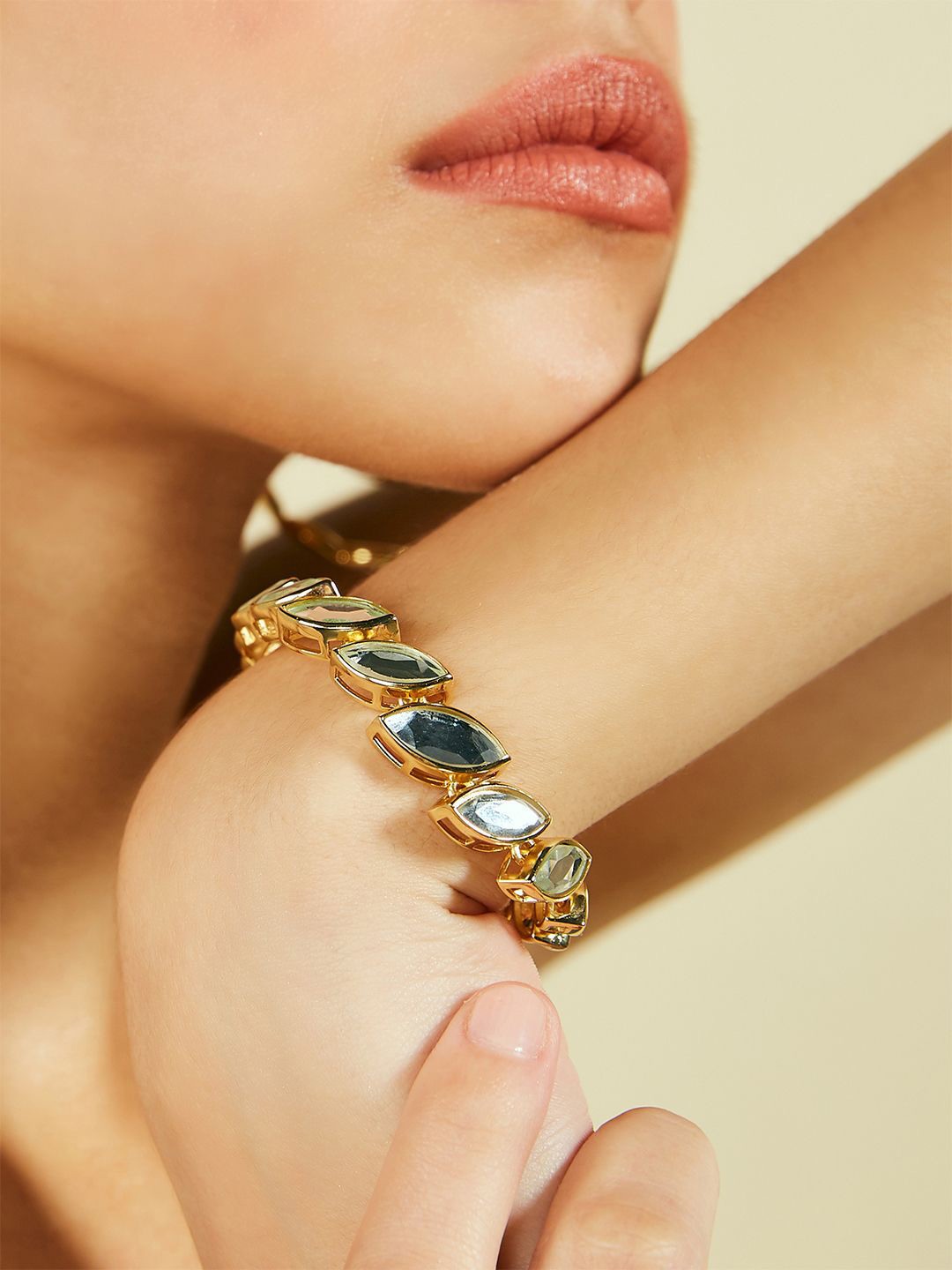 

Isharya Marquise Mirror Bolo Gold Plated Artificial Stones Studded Link Bracelet